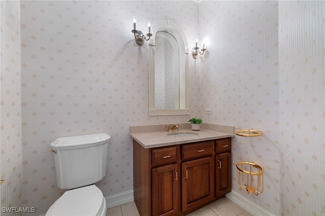 bathroom featuring toilet, tile patterned floors, and vanity