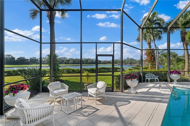 exterior space with a lanai and a water view