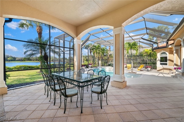 unfurnished sunroom with a water view