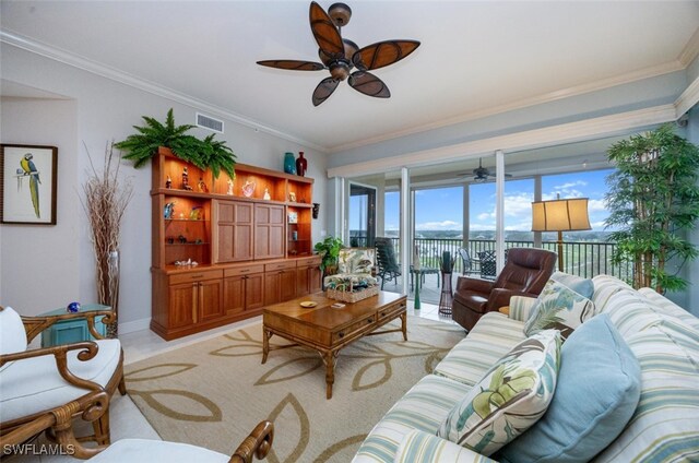 living room featuring ceiling fan and ornamental molding