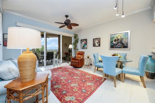 sitting room featuring tile patterned floors, crown molding, and ceiling fan