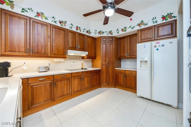 kitchen with white fridge with ice dispenser, black electric stovetop, brown cabinets, and under cabinet range hood