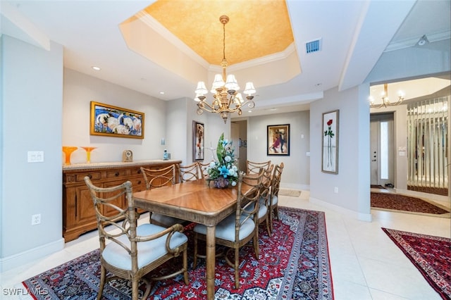 dining room featuring light tile patterned floors, a raised ceiling, visible vents, a chandelier, and baseboards