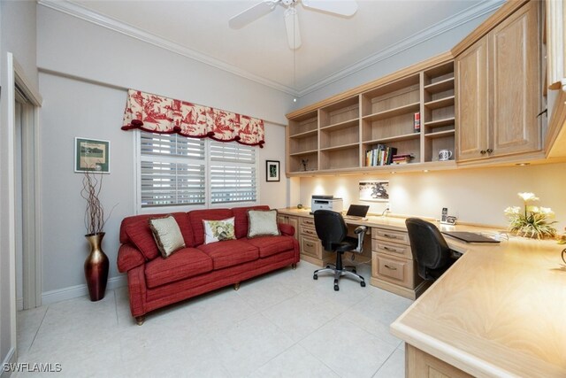 home office featuring ceiling fan, ornamental molding, built in study area, and baseboards