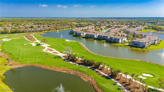 aerial view with view of golf course and a water view