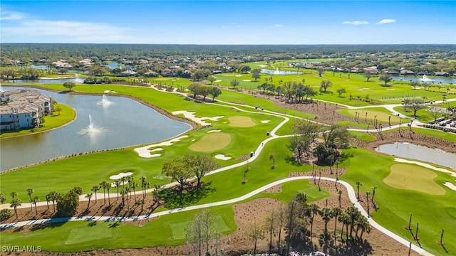 bird's eye view with view of golf course and a water view