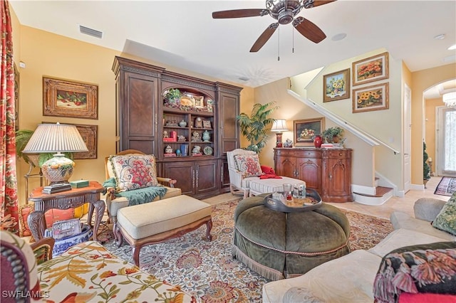 living area featuring light tile patterned flooring and ceiling fan