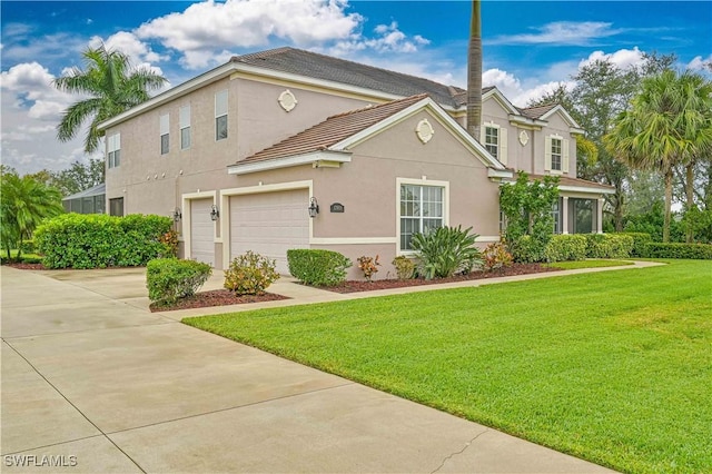 view of property featuring a garage and a front yard