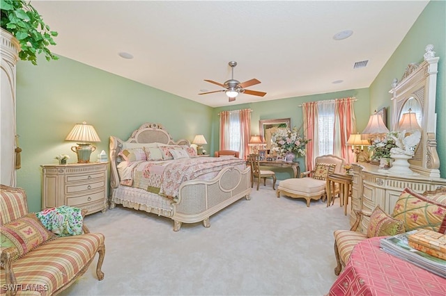 bedroom featuring ceiling fan and carpet