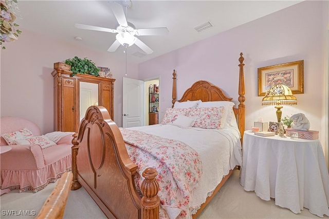 bedroom with light colored carpet and ceiling fan