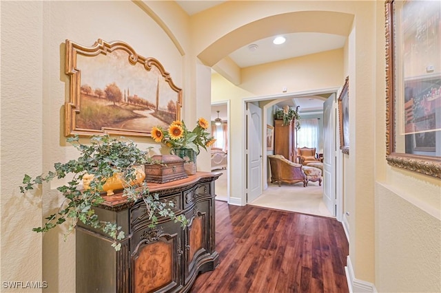 hall with dark hardwood / wood-style floors