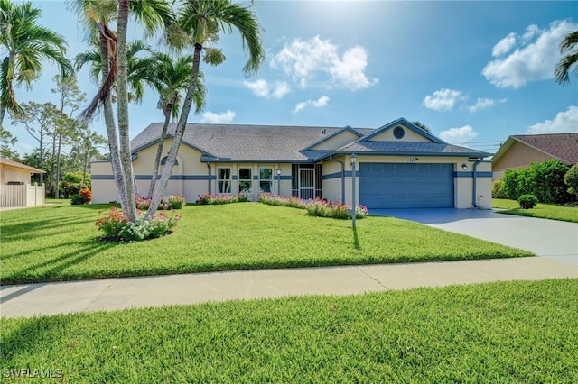 single story home with a front yard and a garage