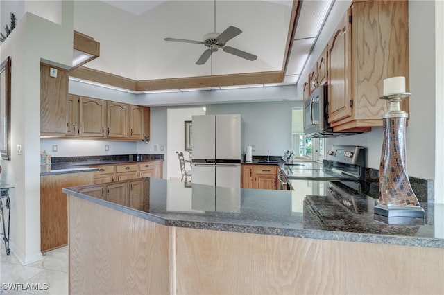 kitchen featuring kitchen peninsula, light tile patterned floors, ceiling fan, and stainless steel appliances