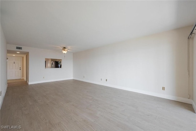 unfurnished living room featuring light hardwood / wood-style flooring and ceiling fan