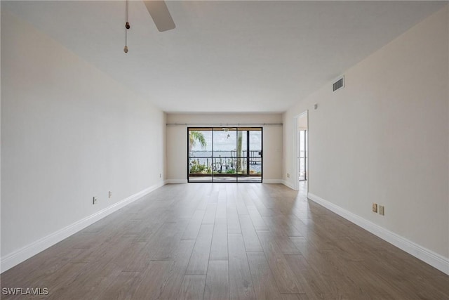 unfurnished room featuring hardwood / wood-style flooring