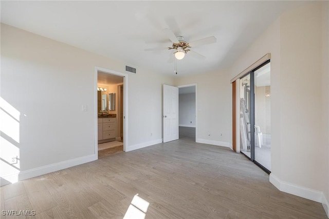 empty room with light hardwood / wood-style floors and ceiling fan