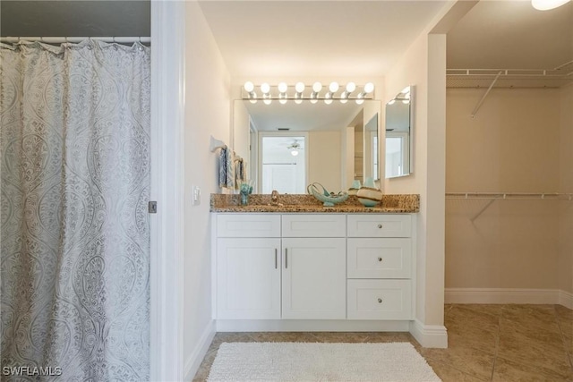 bathroom featuring vanity and tile patterned flooring