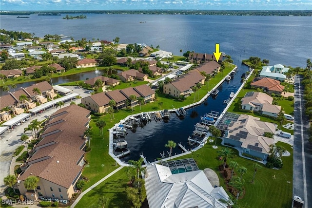 birds eye view of property featuring a water view