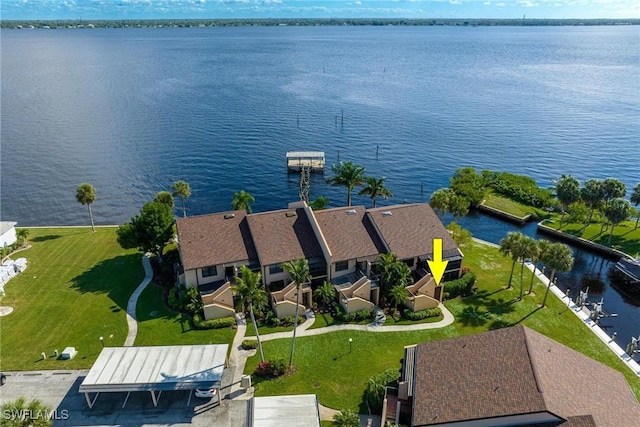 birds eye view of property featuring a water view