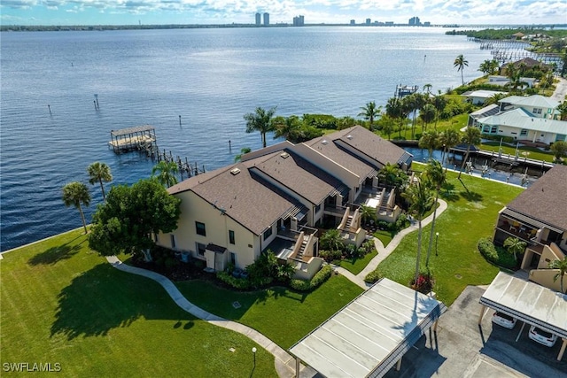 birds eye view of property with a water view