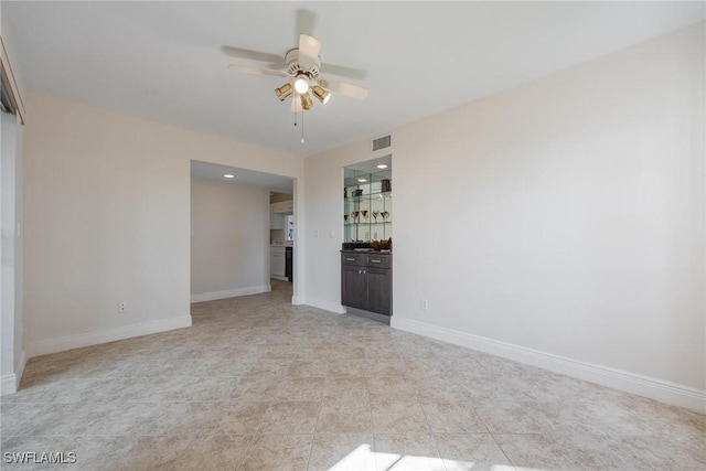 unfurnished room featuring ceiling fan