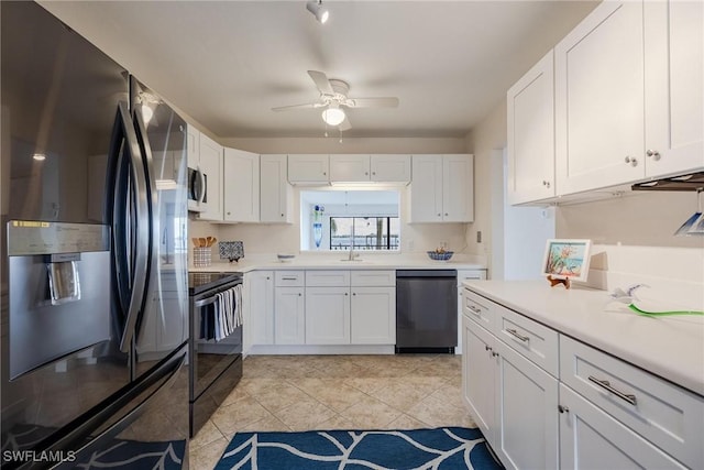 kitchen featuring sink, light tile patterned floors, ceiling fan, stainless steel appliances, and white cabinets