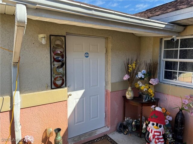 2205/2207 Armour Rd, Lehigh Acres, FL 33973 - property entrance featuring stucco siding
