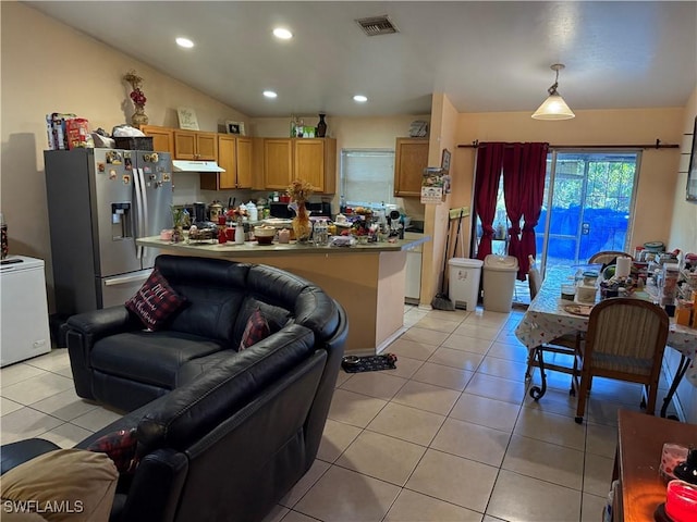 tiled living room featuring lofted ceiling