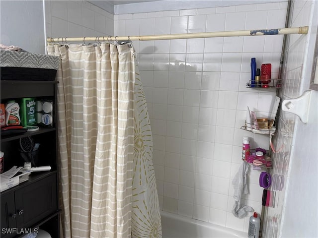 bathroom with shower / tub combo with curtain