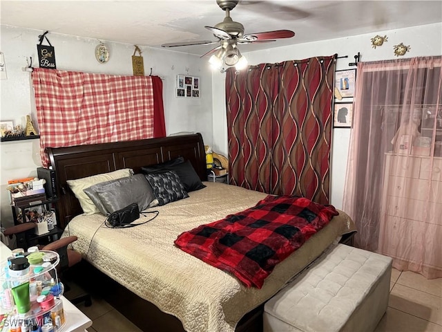 tiled bedroom with ceiling fan