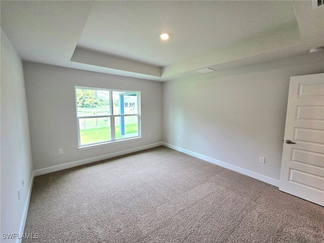 3102 E 2nd St, Lehigh Acres, FL 33936 - carpeted spare room with a raised ceiling, baseboards, recessed lighting, and a smoke detector