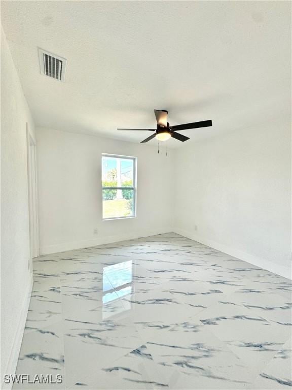 empty room featuring ceiling fan