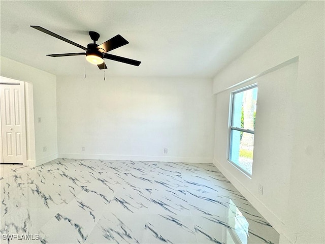 unfurnished room with ceiling fan