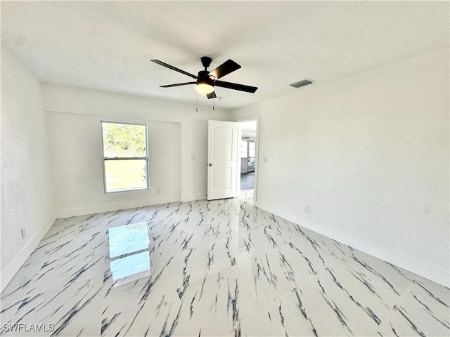 spare room featuring ceiling fan