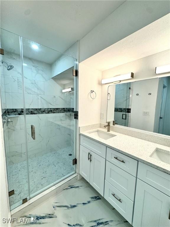 bathroom featuring walk in shower and vanity