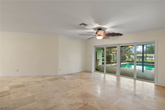 unfurnished room featuring ceiling fan and ornamental molding