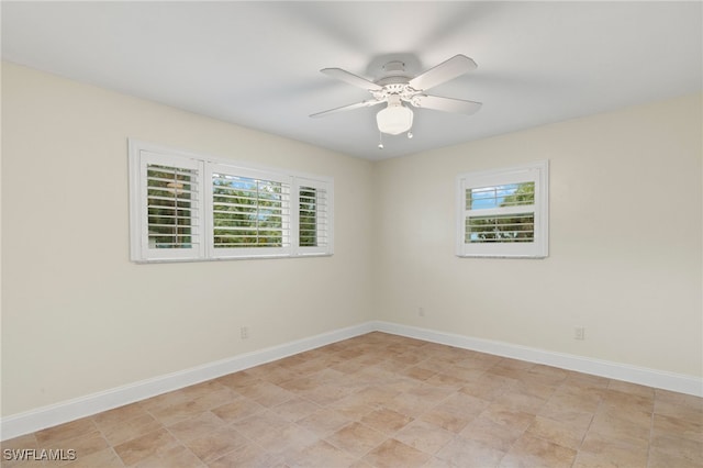 spare room with ceiling fan