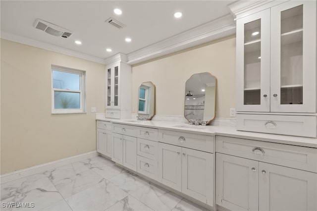 bathroom with vanity and ornamental molding