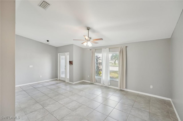 tiled empty room with ceiling fan