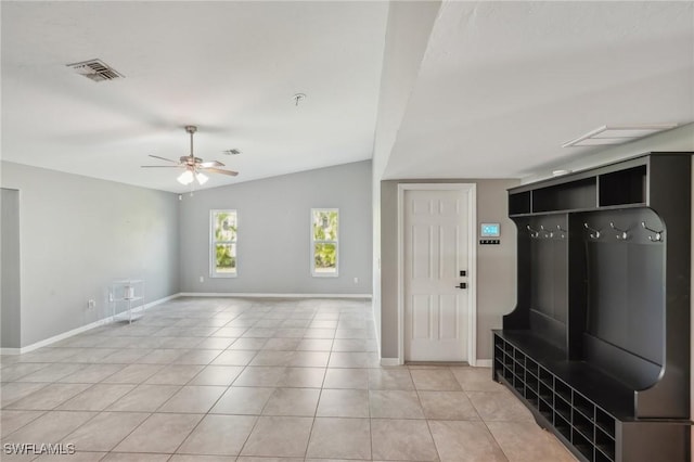 mudroom with vaulted ceiling, ceiling fan, and light tile patterned flooring