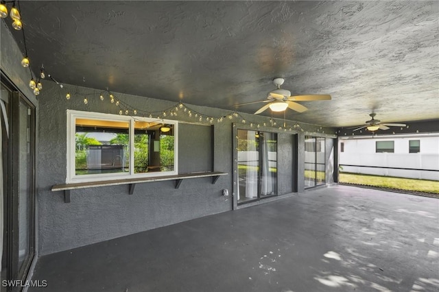 exterior space featuring ceiling fan and a baseboard heating unit