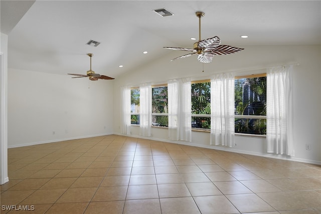 unfurnished room with light tile patterned floors, visible vents, ceiling fan, and vaulted ceiling