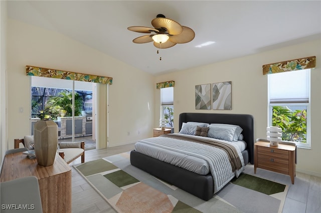 bedroom with lofted ceiling, light wood-style floors, a ceiling fan, and access to outside