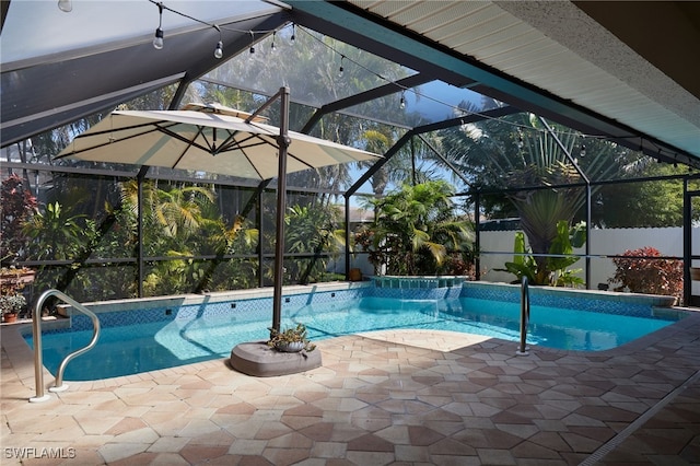 outdoor pool featuring glass enclosure and a patio area