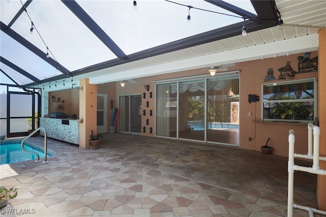 pool with a lanai, a grill, and a patio