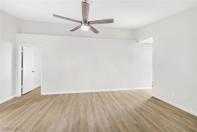 spare room featuring light wood-type flooring and ceiling fan