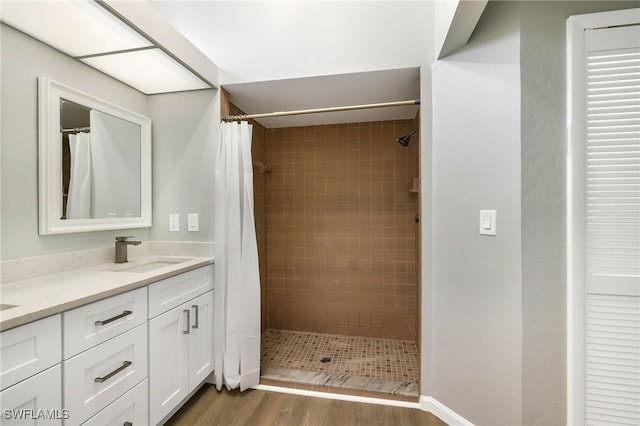 bathroom with vanity, hardwood / wood-style flooring, and a shower with shower curtain