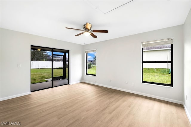 empty room featuring ceiling fan and light wood-type flooring