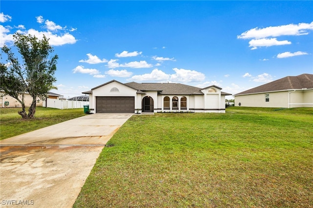 ranch-style home with a garage and a front yard