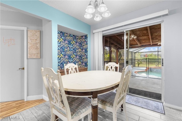 dining space with an inviting chandelier